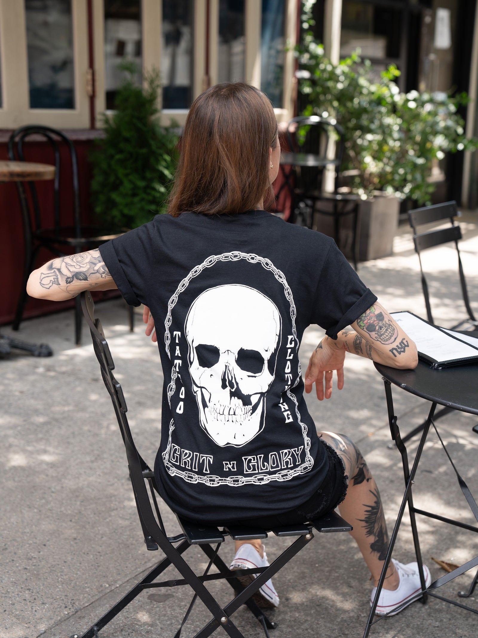 black t-shirt with Grit N Glory skull surrounded by chains 