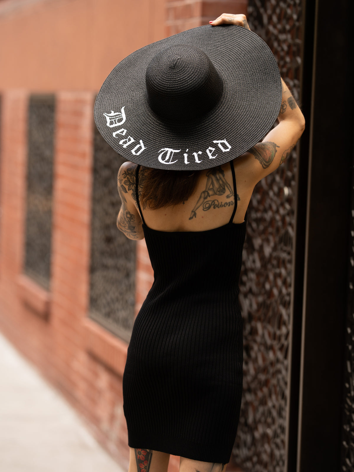 Janice Danger wearing the Dead Tired black sunhat and the As She Was Mini Dress