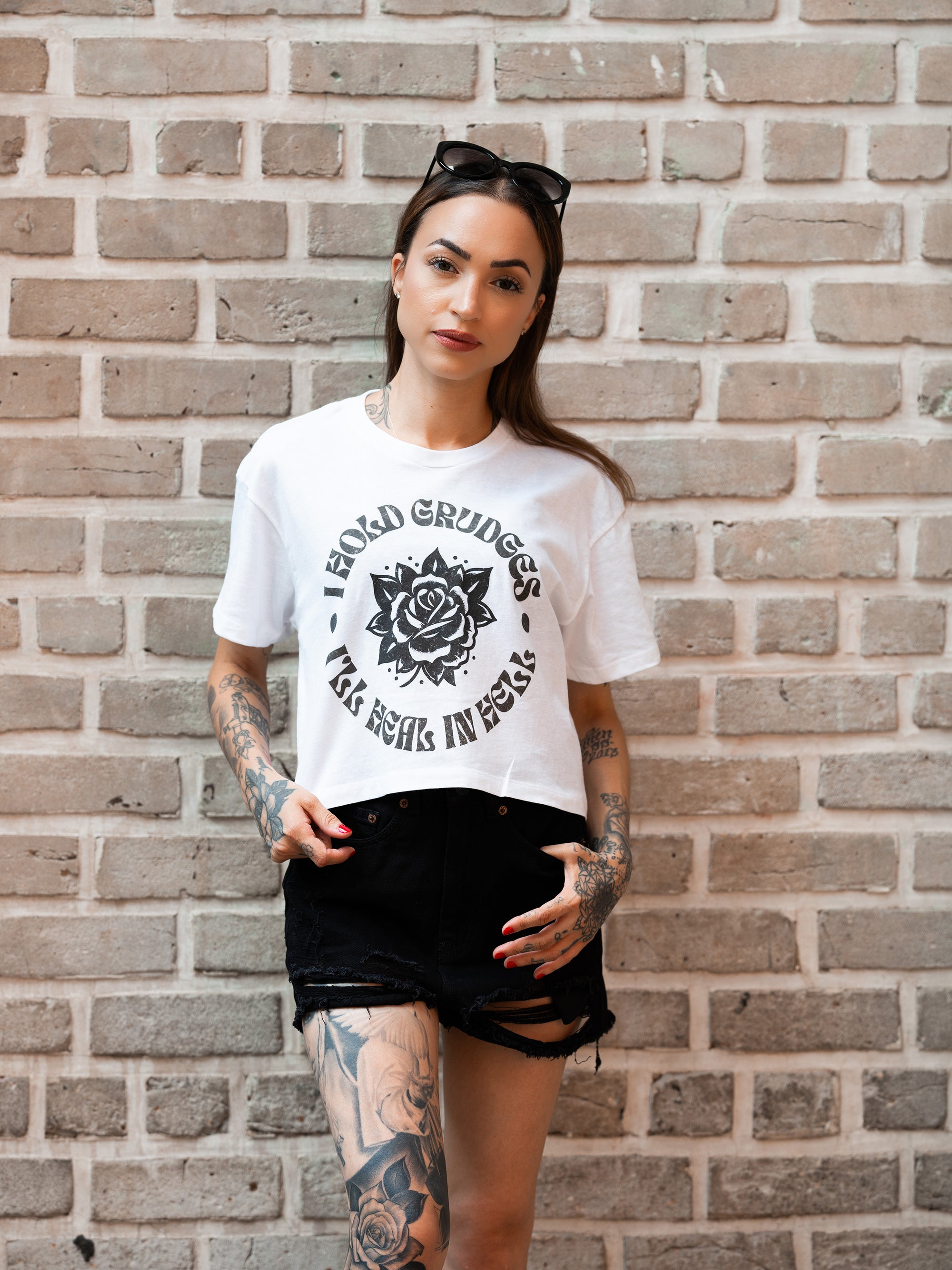 Janice Danger wearing the I Hold Grudges loose fit crop top in white