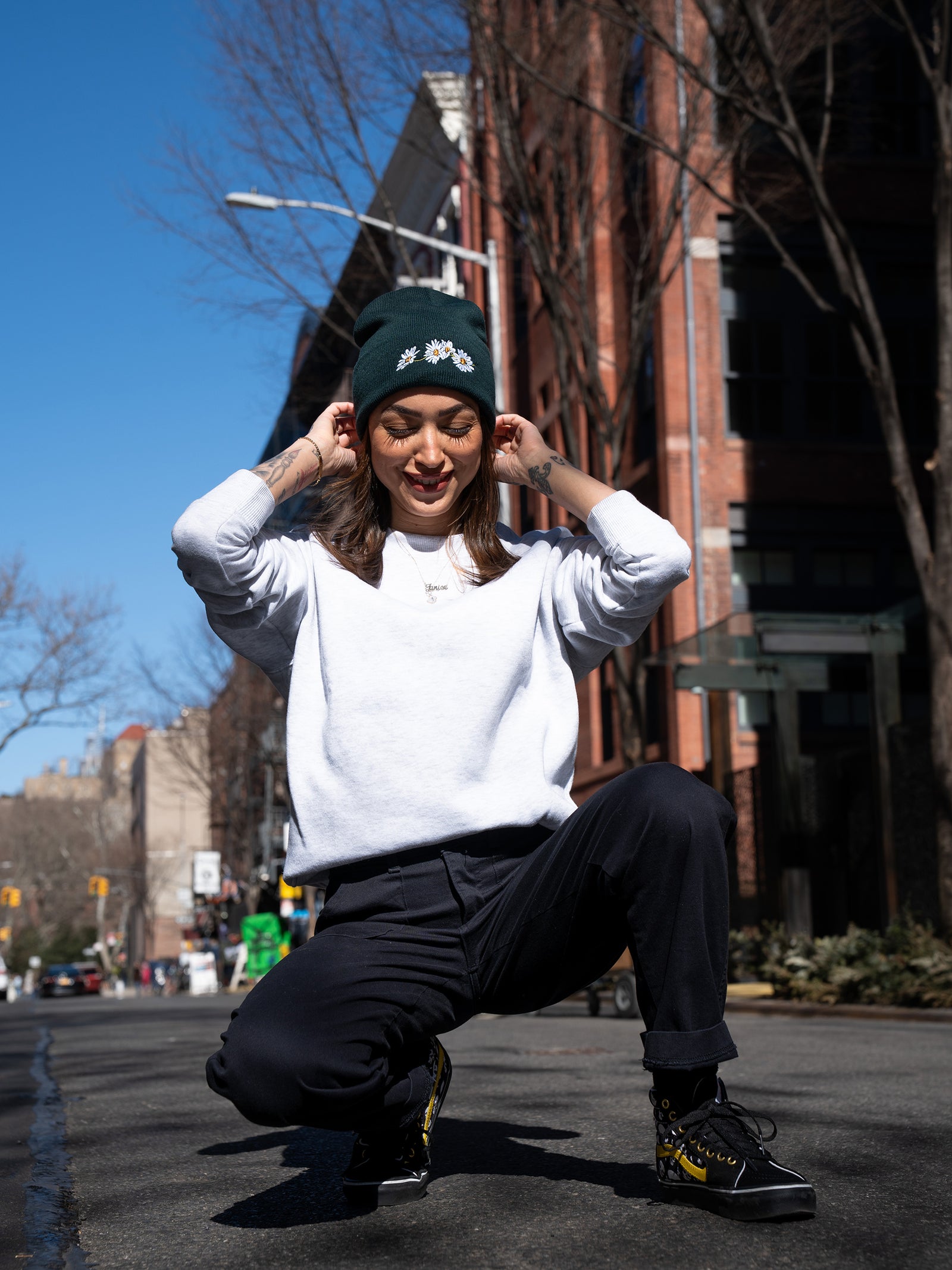 Janice Danger wearing the Nostalgic Daisy pine green beanie and the Grit N Glory classic Vans Shoes. Photographed on Sullivan Street NYC. 