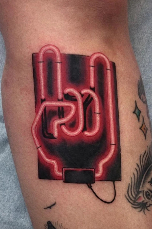 bold red neon rock hand graphic design inspired tattoo by Cavan Infante at Grit n Glory in New York City