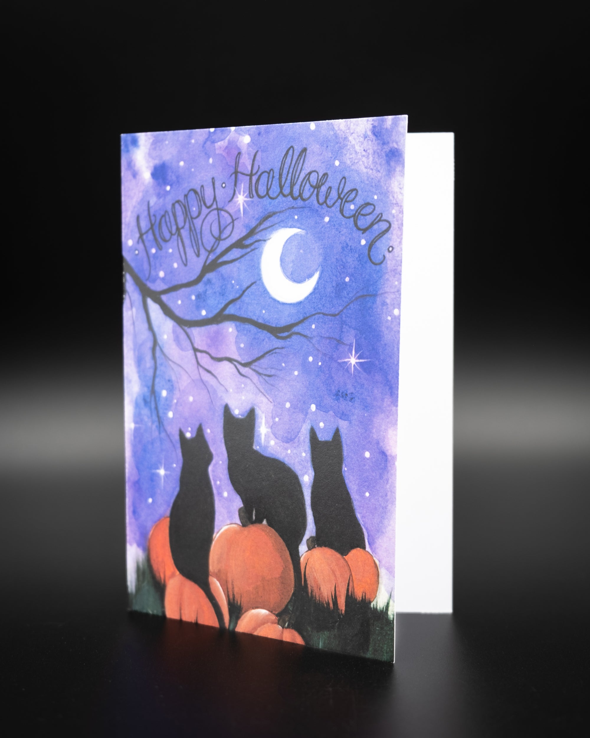 Happy Halloween Greeting card designed by Charlotte Timmons featuring a night time Halloween scene. 