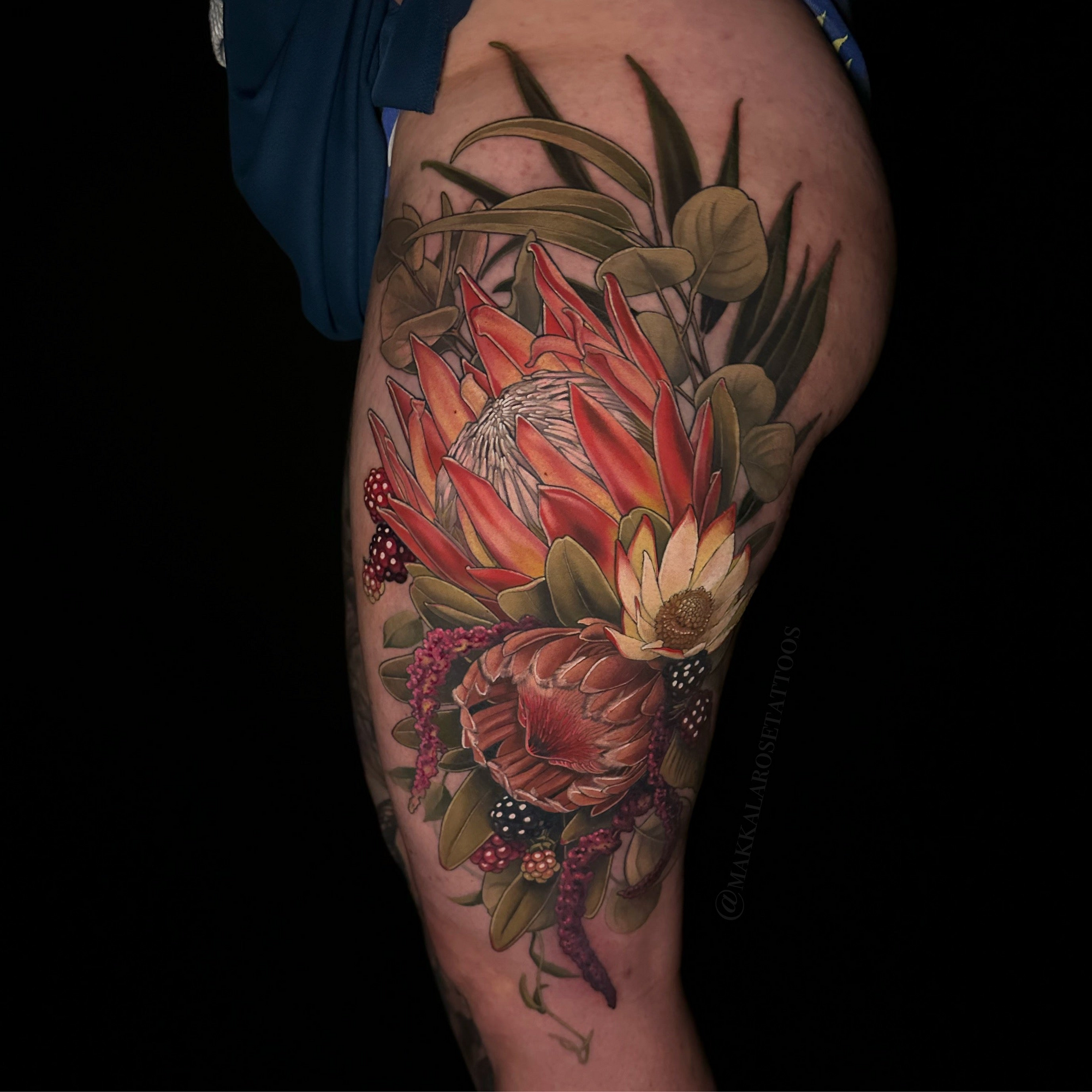 color floral and botanical upper leg tattoo by Makkala Rose