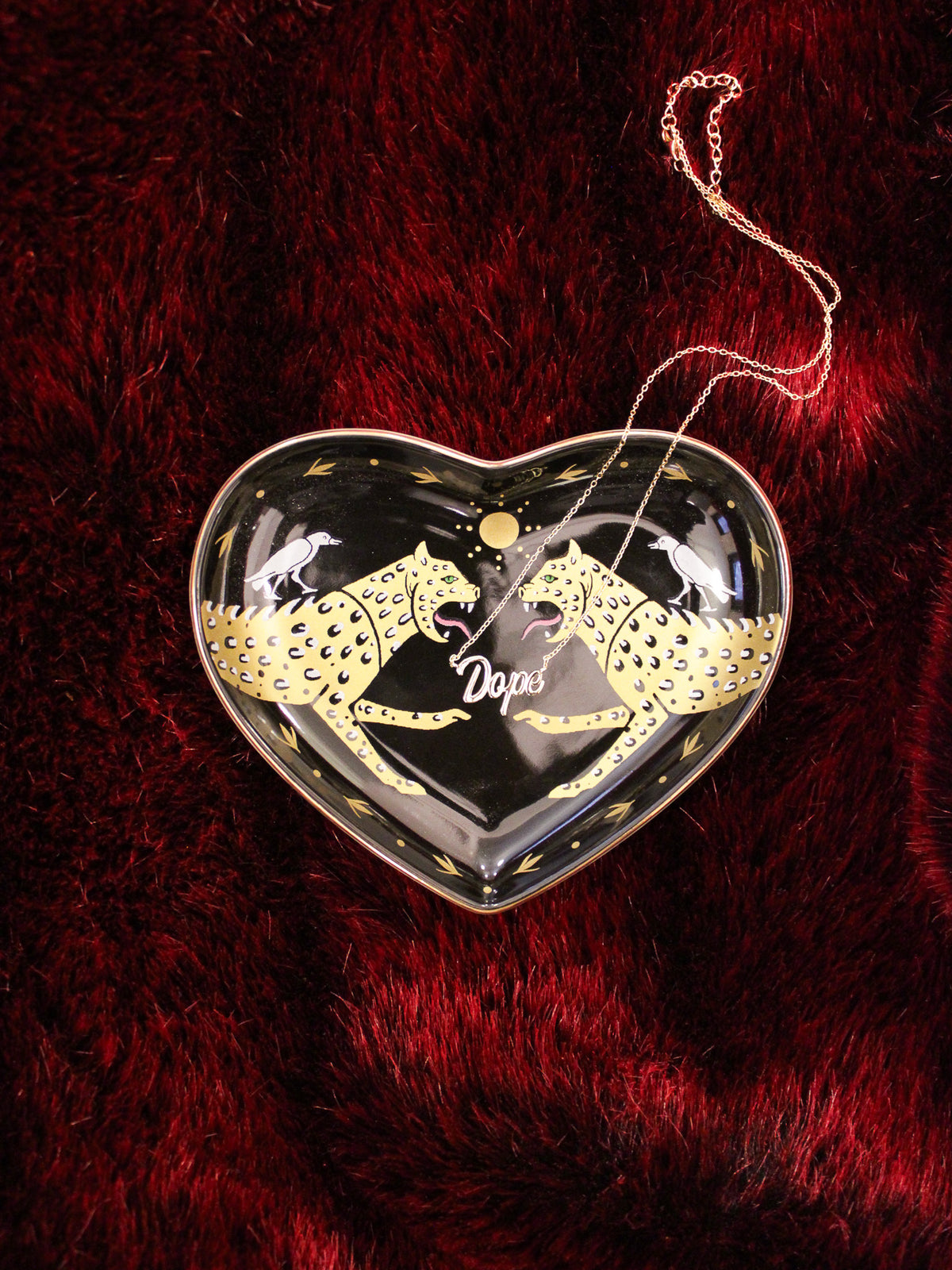 ceramic heart shaped black dish with gold cheetahs