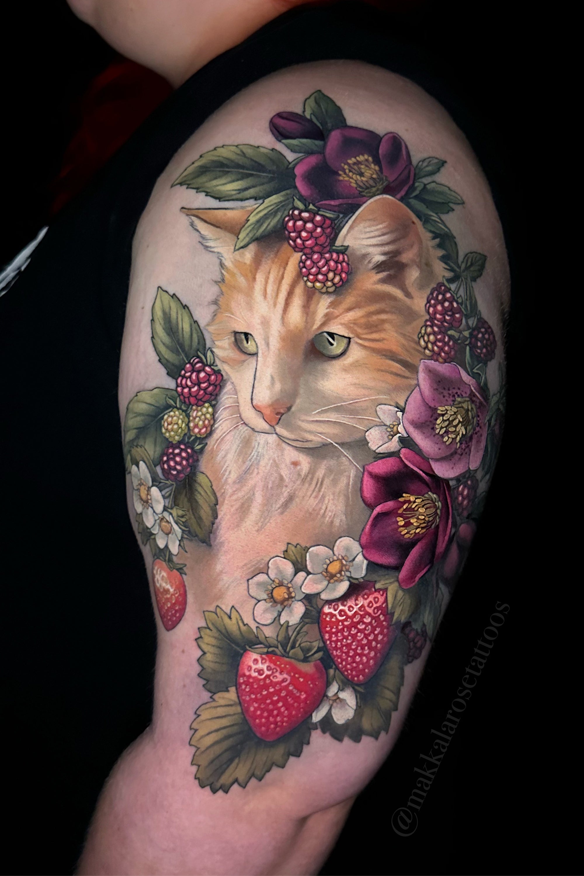 Full color cat with berries and floral upper arm tattoo by Makkala Rose now booking at Grit n Glory in New York City