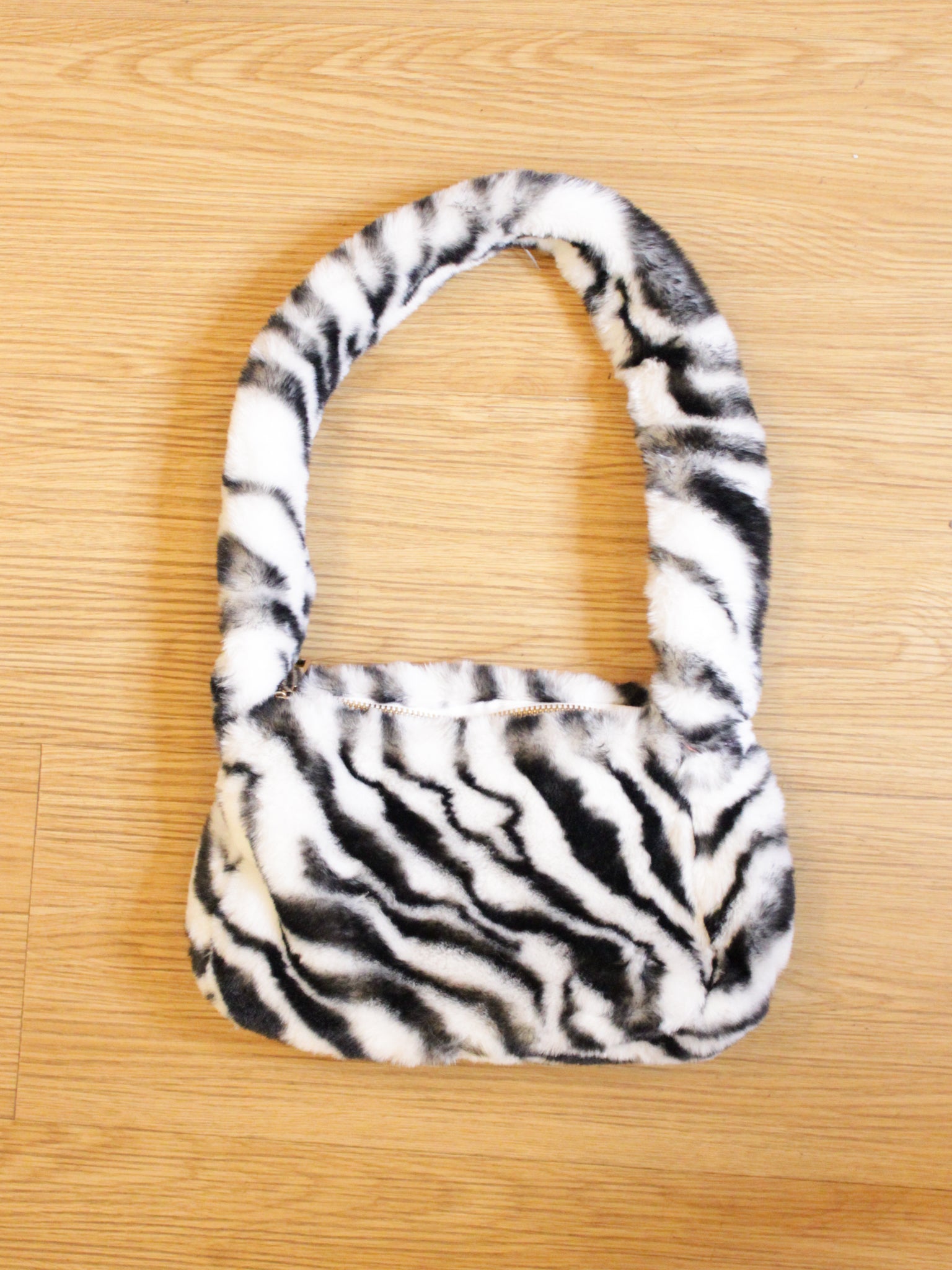 zebra striped fuzzy handbag